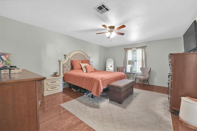 bedroom featuring ceiling fan and hardwood / wood-style floors