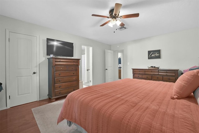 bedroom featuring ceiling fan and dark wood-type flooring