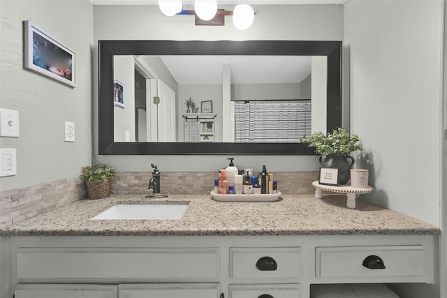 bathroom featuring vanity, a shower with curtain, and backsplash