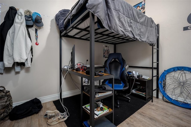 bedroom with hardwood / wood-style floors