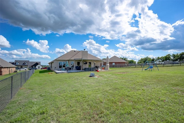 view of yard with a playground and a patio