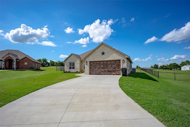 view of front of home featuring a garage and a front lawn