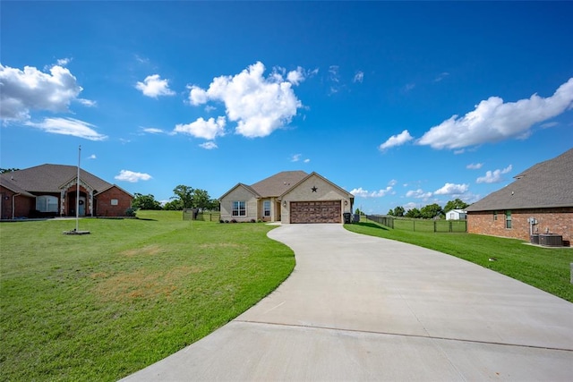 view of front of property with a front lawn, central AC unit, and a garage