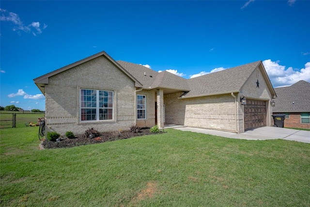 view of front of property with a garage and a front lawn