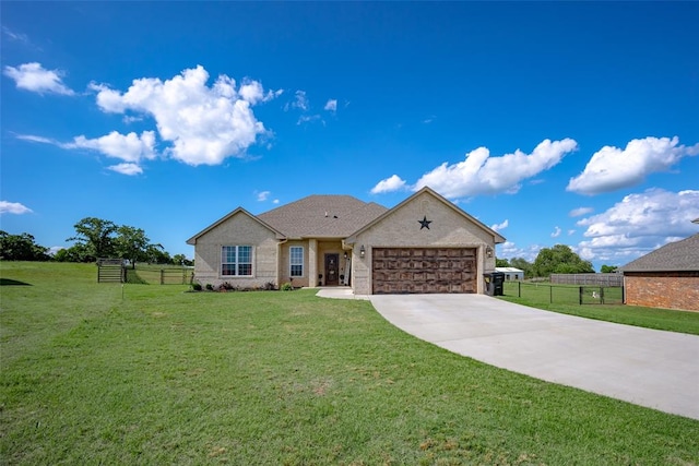 view of front of house featuring a garage and a front yard