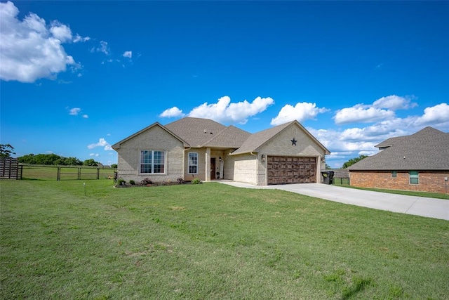 view of front facade featuring a front yard and a garage