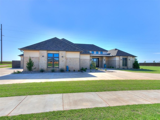 prairie-style house with a front lawn