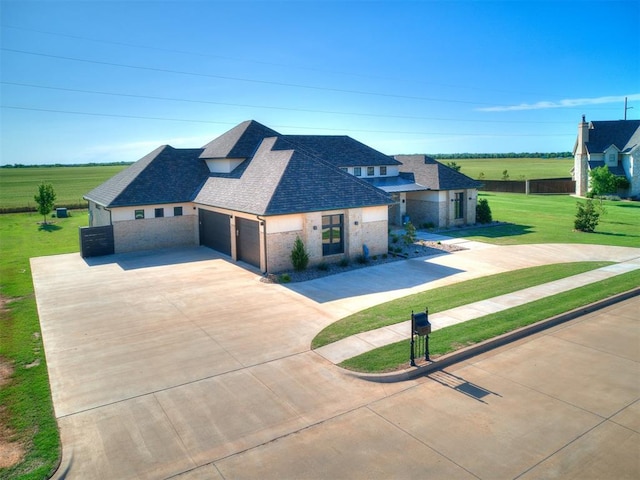 view of front facade with a garage and a front lawn