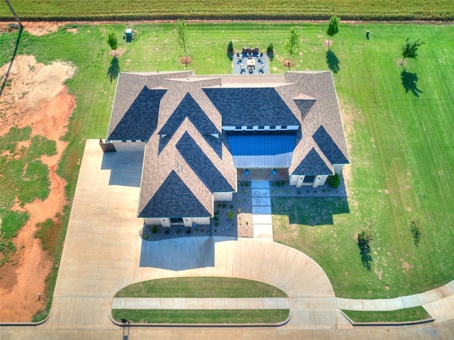 birds eye view of property featuring a rural view