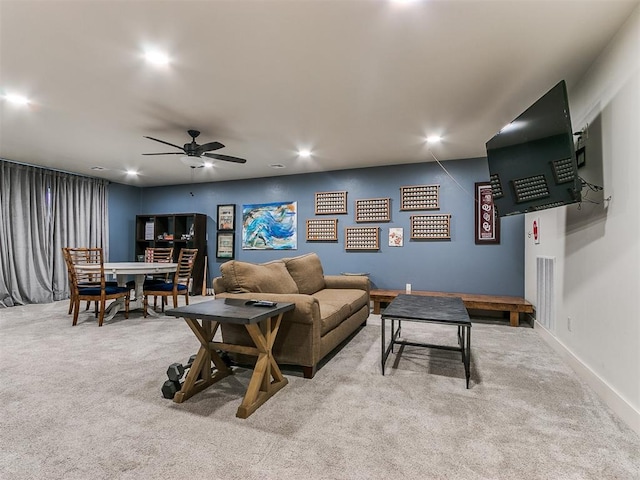 carpeted living room featuring ceiling fan