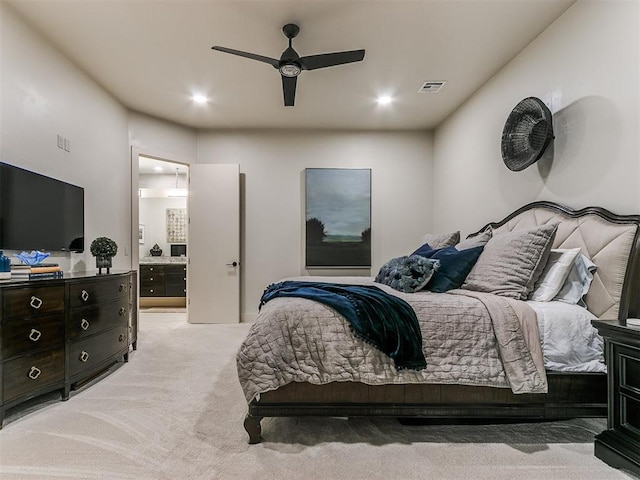 bedroom with ceiling fan and light colored carpet