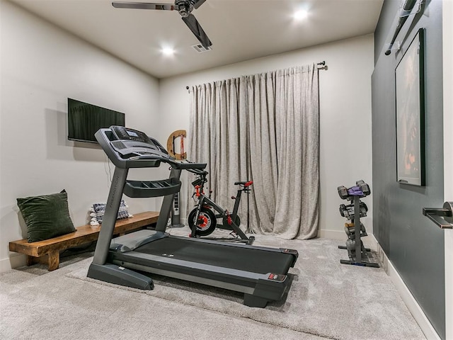 exercise area with ceiling fan and carpet floors