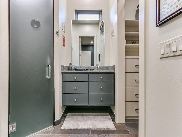 bathroom featuring tile patterned floors and vanity