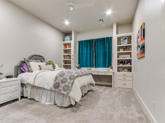 bedroom featuring light carpet and ceiling fan