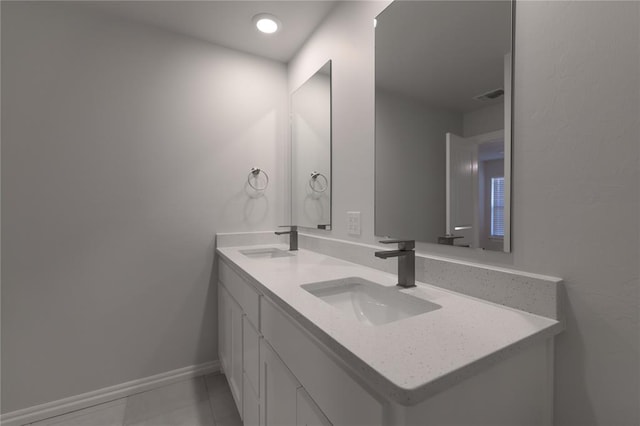 bathroom with tile patterned flooring and vanity