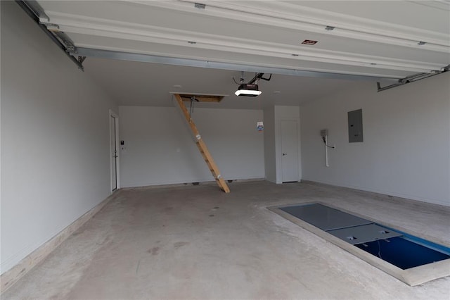 garage with electric panel and a garage door opener