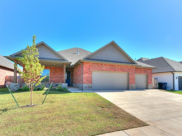 view of front of house featuring a garage and a front yard