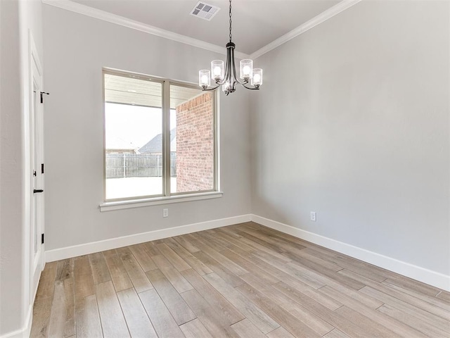 unfurnished room with a chandelier, light hardwood / wood-style flooring, and crown molding