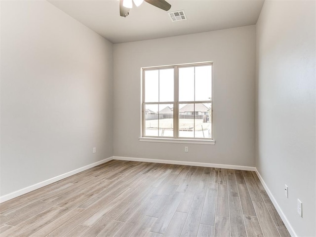 unfurnished room featuring ceiling fan and light hardwood / wood-style flooring