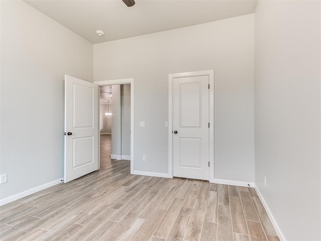 unfurnished bedroom featuring ceiling fan and light hardwood / wood-style flooring