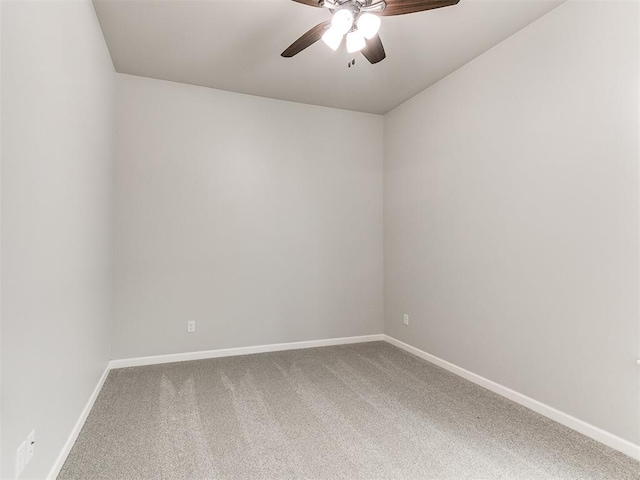 empty room featuring ceiling fan and carpet floors