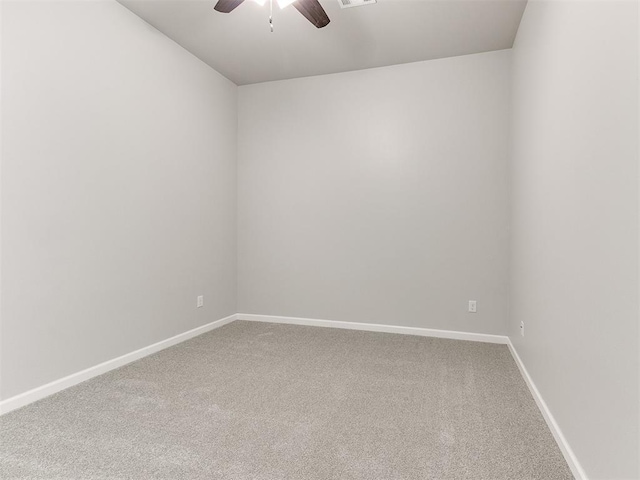 empty room with carpet flooring and ceiling fan