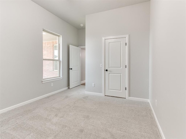 spare room with light carpet