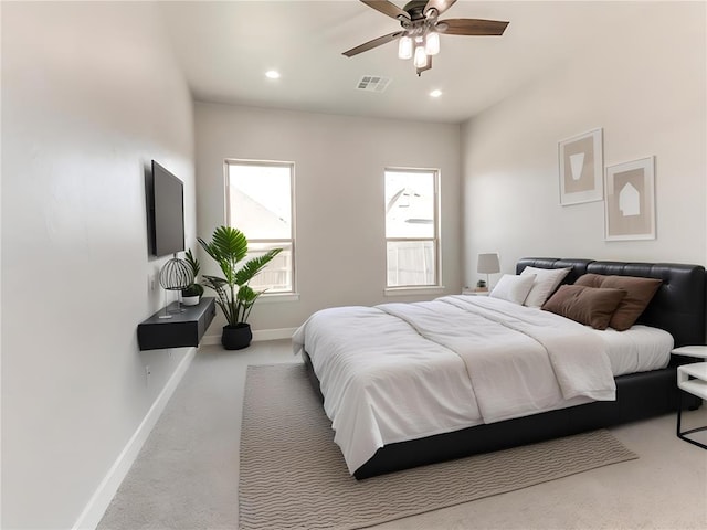 bedroom with ceiling fan and carpet floors