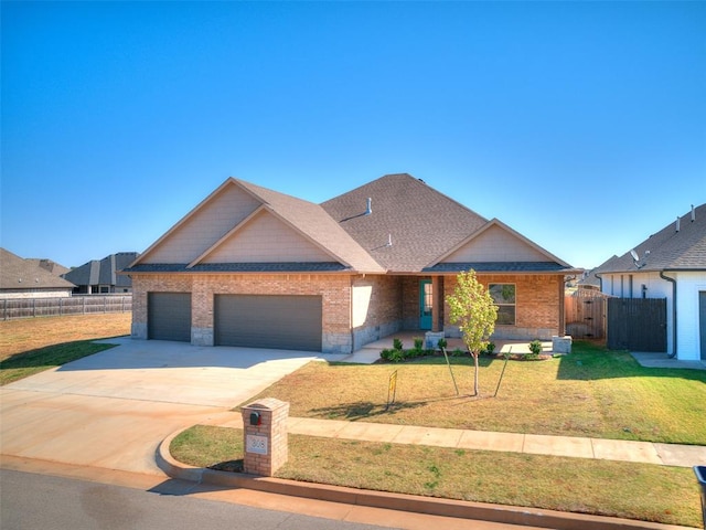 view of front facade with a garage and a front lawn