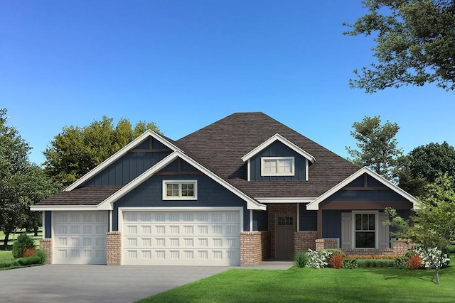 craftsman house featuring a front lawn and a garage