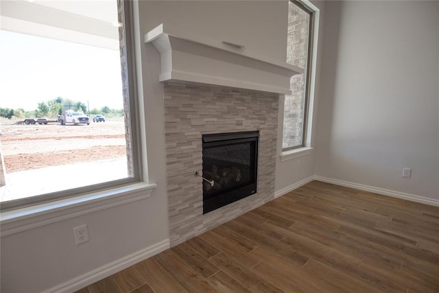 unfurnished living room featuring wood-type flooring