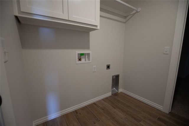 clothes washing area featuring hookup for an electric dryer, dark hardwood / wood-style flooring, cabinets, and washer hookup