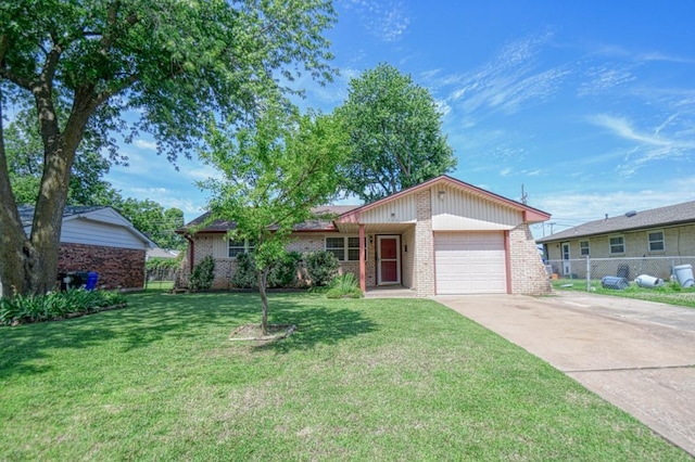 single story home featuring a garage and a front lawn