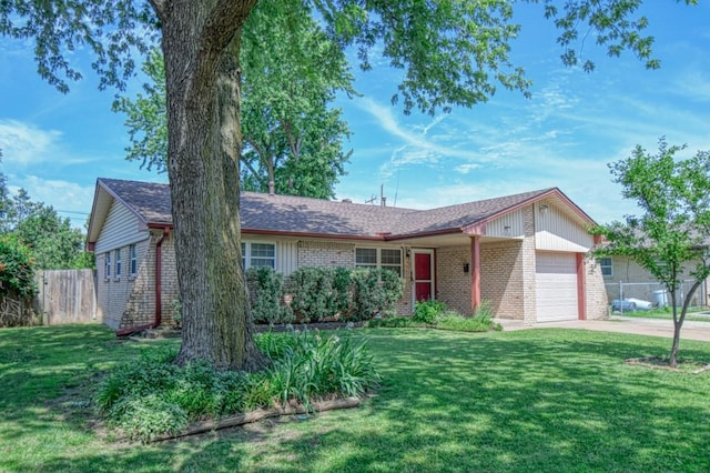 ranch-style house featuring a garage and a front lawn