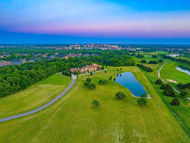 aerial view at dusk with a water view