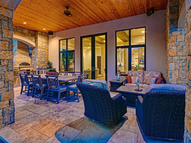 view of patio / terrace featuring an outdoor living space and an outdoor kitchen