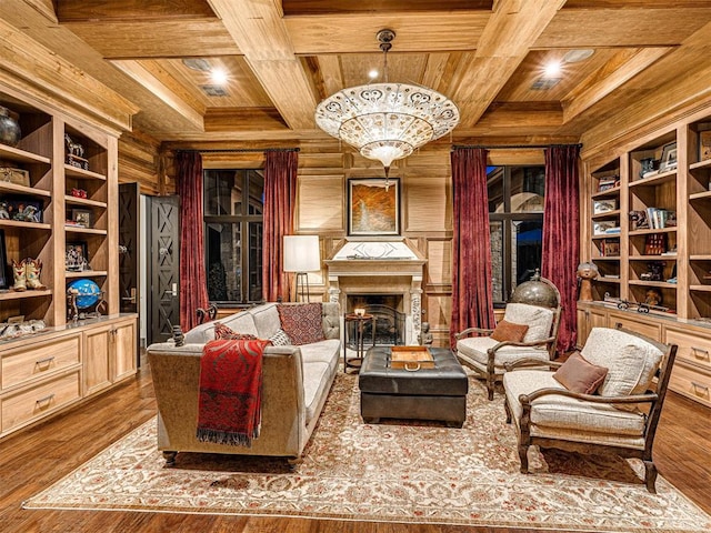 sitting room featuring hardwood / wood-style flooring, wood ceiling, coffered ceiling, and an inviting chandelier