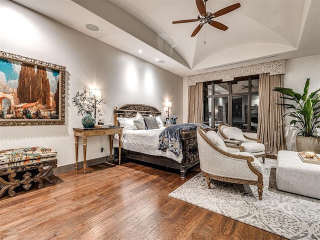 bedroom featuring hardwood / wood-style flooring, ceiling fan, and lofted ceiling