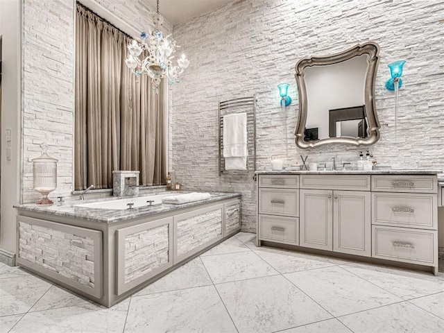 bathroom with vanity and a notable chandelier