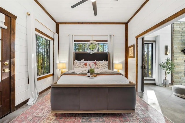 bedroom with ceiling fan and ornamental molding