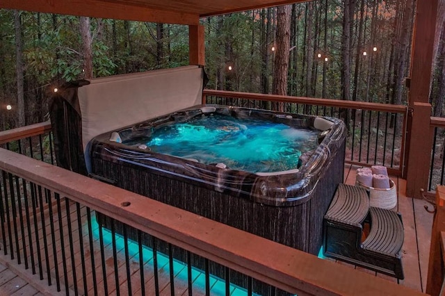 deck featuring a hot tub