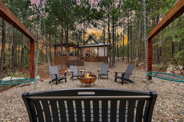 yard at dusk with an outdoor fire pit