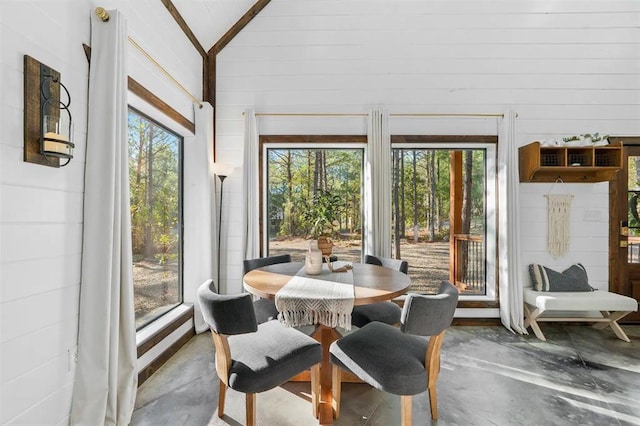 sunroom / solarium featuring a wealth of natural light and vaulted ceiling