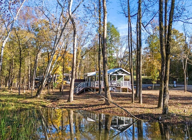 view of dock featuring a deck with water view