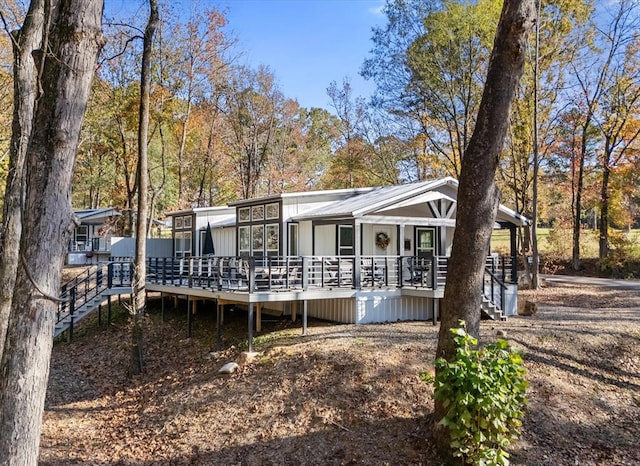 view of front of property featuring a wooden deck