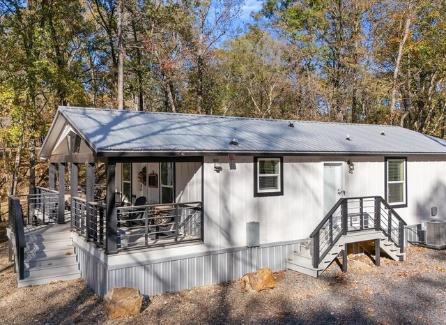 back of house with cooling unit