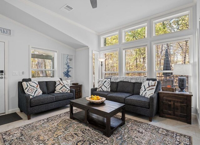 living room featuring lofted ceiling, ceiling fan, and crown molding