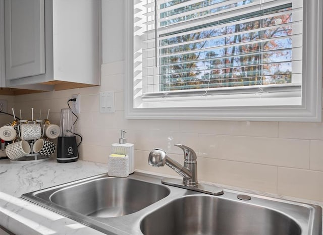 interior details with decorative backsplash and sink