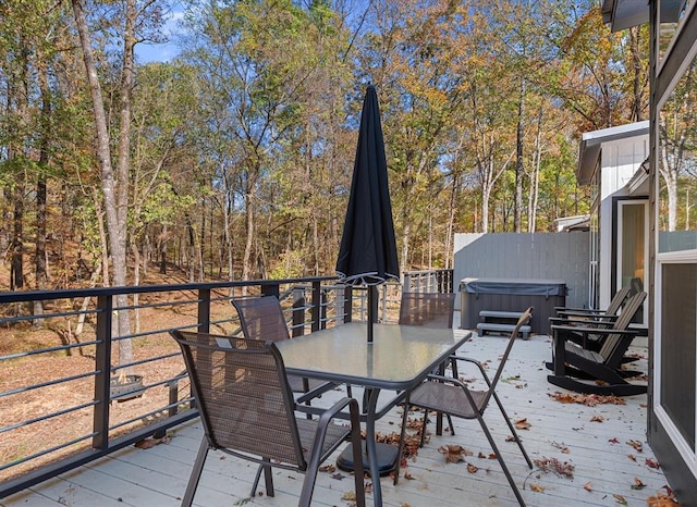 wooden deck with a hot tub