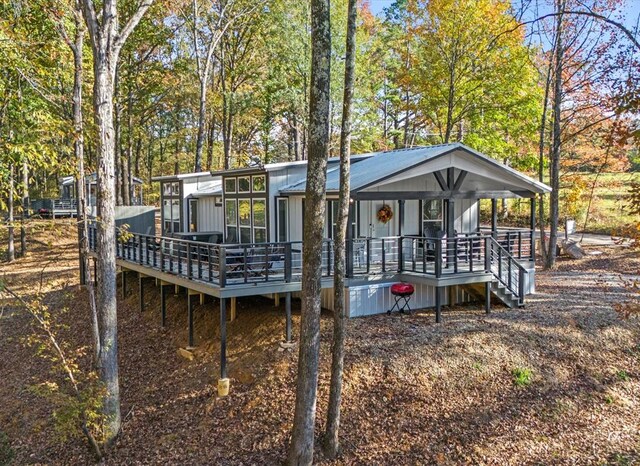 exterior space with a sunroom and a deck